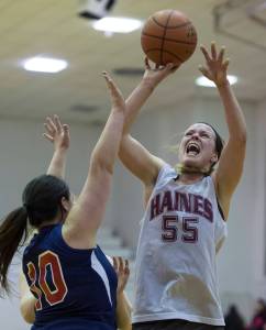Haines&rsquo; Alisa Beske, right, shoots over Yakutat&rsquo;s Nadine Fraker during their Women&rsquo;s bracket game in the Juneau Lion&rsquo;s Gold Medal Basketball Tournament at Juneau-Douglas High School on Tuesday, March 20, 2018. Yakutat won the game 60-52. (Michael Penn | Juneau Empire)