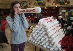 Clara Don, 14, blows up &lsquo;thunder sticks&rsquo; for Kick Butts Day at Juneau-Douglas High School on Wednesday, March 21, 2018. (Michael Penn | Juneau Empire)