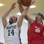 Kake&rsquo;s Keith Nelson, right, blocks a shot by Yakutat&rsquo;s Greg Indreland in the Masters bracket in the Juneau Lion&rsquo;s Gold Medal Basketball Tournament at Juneau-Douglas High School on Wednesday, March 21, 2018. Kake won 60-50. (Michael Penn | Juneau Empire)