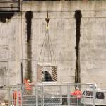 In this his April 23, 2008 photo, a caged sea lion is lifted above the Columbia River near Bonneville Dam in North Bonneville, Washington. Two species of fish listed as threatened under the Endangered Species Act are facing a growing challenge in Oregon from hungry sea lions. The federally protected California sea lions are traveling into the Columbia River and its tributaries to snack on fragile fish populations. After a decade killing the hungriest sea lions in one area, wildlife officials now want to expand the program. (Don Ryan | The Associated Press File)