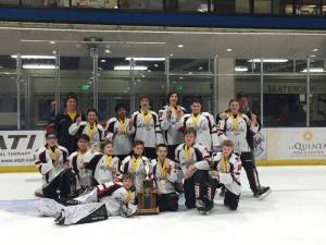 The Juneau Capitals 12U B hockey team pose on the ice after winning the state championship.Front:; Caleb Friend (Goalie). Middle: Joseph Aline; Matthew Plang; Keegan Clancy; Macabee Brna; Kelton Griffith; Aiden Allison; Dane Pederson. Back: Kevin Hansen; Bailey Hansen; Matthew Parise; Gabriel Hansen; Lake Bartlett; Matthew Munoz; Allesandra Friend; Steve Quin. Coaches Not in Photo: Jason Kohlhase; Dave Kovach; Mike Bovitz. (Courtesy Photo | www.alaskastatehockey.com)
