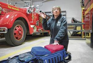 Kathy Miller talks on Tuesday, March 6, 2018, about her 10 years as a volunteer firefighter/EMT for Capital City Fire/Rescue at the Lynn Canal Fire Station after a career as a nurse. (Michael Penn | Juneau Empire)