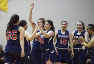 Yakutat&rsquo;s women&rsquo;s team celebrates beating Haines in the Women&rsquo;s final in the Juneau Lion&rsquo;s Gold Medal Basketball Tournament at Juneau-Douglas High School on Saturday, March 24, 2018. (Michael Penn | Juneau Empire)