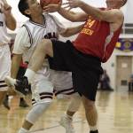 Hoonah&rsquo;s Kin Willard Jr., left, and Kake&rsquo;s Jeff Dean fight for a rebound in the Master&rsquo;s bracket final at the Juneau Lion&rsquo;s Gold Medal Basketball Tournament at Juneau-Douglas High School on Saturday, March 24, 2018. (Michael Penn | Juneau Empire)
