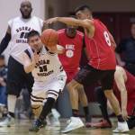 Hoonah&rsquo;s Kamal Lindoff, left, steals the ball from Kake&rsquo;s Jay Peterson in the Master&rsquo;s bracket final at the Juneau Lion&rsquo;s Gold Medal Basketball Tournament at Juneau-Douglas High School on Saturday, March 24, 2018. (Michael Penn | Juneau Empire)