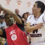 Kake&rsquo;s Kip Howard keeps the ball away from Hoonah&rsquo;s Ken Willard Jr. in the Master&rsquo;s bracket final at the Juneau Lion&rsquo;s Gold Medal Basketball Tournament at Juneau-Douglas High School on Saturday, March 24, 2018. (Michael Penn | Juneau Empire)