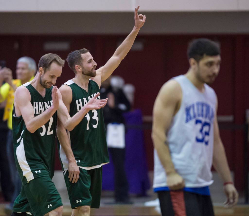 Haines&rsquo; Tyler Healy, left, and Kyle Rush celebrate their win over Klukwan in the B bracket final at the Juneau Lion&rsquo;s Gold Medal Basketball Tournament at Juneau-Douglas High School on Saturday, March 24, 2018. (Michael Penn | Juneau Empire)