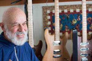 George Gress speaks with a reporter at his home in Juneau on Tuesday, March 27, 2018 about his three-year tenure making guitars for clients across the country. Richard McGrail | For the Capital City Weekly
