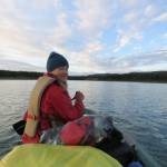Mary Catharine Martin at the end of Lake LaBerge, happy to enter the Yukon River proper. (Photo by Bjorn Dihle)