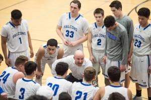 Thunder Mountain&rsquo;s coach John Blasco encourages his team during a timeout against Ketchikan at TMHS on Friday, Feb. 23, 2018. Ketchikan won 57-31.