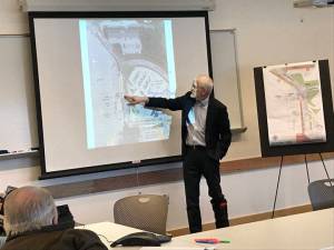 Michael Carlson, Principal Architect at McCool, Carlson, Green, of Anchorage, shows possible design plans for the Juneau International Airport&rsquo;s North Gate construction project during a public meeting at the airport Tuesday. (Gregory Philson | Juneau Empire)