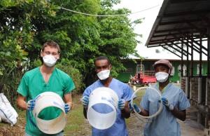 In this Nov. 17, 2016 photo, Gavin McNicol, Junior Jules Francois and Denis Darline are photographed at SOIL Haiti&rsquo;s composting site near Cap-Ha&