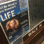 A poster featuring Bree Moore and encouraging action against dating violence is seen on the Alaska State Capitol office door of Rep. Harriet Drummond, D-Anchorage, on April 5, 2018. (James Brooks | Juneau Empire)