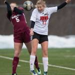 Juneau-Douglas&rsquo; Taylor Bentley, right, heads the ball against Ketchikan&rsquo;s Jessilynn Sivertsen at Thunder Mountain High School on Friday, April 6, 2018. JDHS won 8-0. (Michael Penn | Juneau Empire)