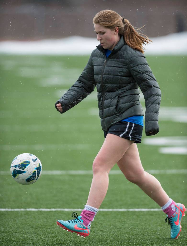 Junior Sally Thompson runs through drills during Thunder Mountain High School girls varsity soccer practice at TMHS on Monday. (Michael Penn | Juneau Empire)