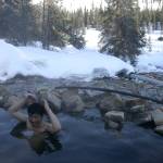 Tohru Saito soaks in Kwiniuk Hot Springs near Elim. (Ned Rozell | For the Juneau Empire)