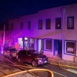 Juneau Capital City Fire/Rescue firefighters work a building fire at North Franklin and Second Street on Monday, April 16, 2017. (Michael Penn | Juneau Empire)