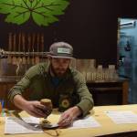 Ryan Lindsay, co-founder of Devil&rsquo;s Club Brewing Co., serves a stout to a customer on Wednesday, the opening day for the brewery&rsquo;s new taproom on Franklin Street. (Kevin Gullufsen | Juneau Empire)