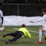 Juneau-Douglas&rsquo; , right, challenges Kenai&rsquo;s Travis Verkuilen for the ball at Adair-Kennedy Memorial Field on Thursday, April 19, 2018. (Michael Penn | Juneau Empire)