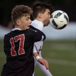 4 challenges Kenai&rsquo;s Riley McKee for the ball at Adair-Kennedy Memorial Field on Thursday, April 19, 2018. (Michael Penn | Juneau Empire)