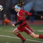 Juneau-Douglas&rsquo; Clem Taylor-Roth stretches to head a cross against West Anchorage at Adair-Kennedy Memorial Park on Friday, April 20, 2018. West won 3-1. (Michael Penn | Juneau Empire)