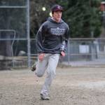 Freshman Olin Rawson performs a base-running drill during Juneau-Douglas High School baseball practice on Wednesday, April 25, 2018. (Nolin Ainsworth | Juneau Empire)