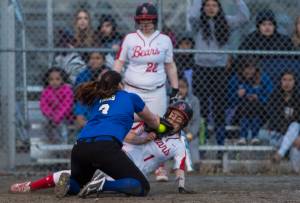 Thunder Mountain&rsquo;s Nina Fenumiai, right, tags out Juneau-Douglas&rsquo; Elisa Fabrello trying to steal home on a passed ball at Dimond Park on Friday. TMHS won 11-4. (Michael Penn | Juneau Empire)