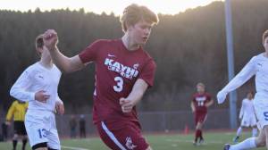 Kayhi&rsquo;s Grant Collins tries to save the ball from going out of bounds. (Erin Laughlin | For the Juneau Empire)
