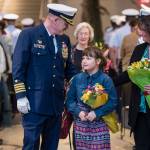 Capt. Phillip Thorne, outgoing Commander of Coast Guard Sector Juneau, walks with his wife, Jennifer, daughter, Madeline, 8, and mother, Gloria Thorne, at the conclusion of his Change of Command and Retirement Ceremonies at the Alaska State Museum on Friday, May 4, 2018. (Michael Penn | Juneau Empire)