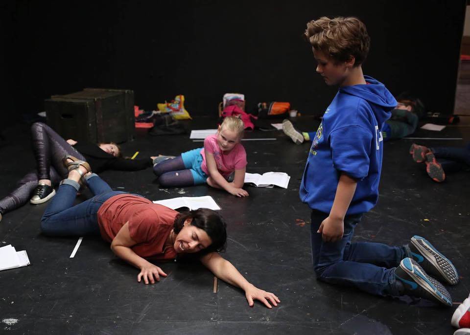 During a rehearsal of Tales from the Nine Worlds: Selections from Neil Gaiman&rsquo;s &ldquo;Norse Mythology,&rdquo; director/adapter Julie York Coppens instructs actors Lydia Heidemann (as Heimdall) and Denali Schivens (as Loki) in the fine art of dying in battle during a mythic apocalypse. The production, an epic adventure for all ages, plays this weekend (May 18-21) in the Phoenix studio space at Perseverance, 914 Third Street in Douglas. Photo by Brian Wallace.