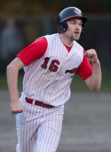 Juneau-Douglas&rsquo; Kasey Watts pumps his fist as he rounds the bases after hitting a home run against Thunder Mountain at Adair-Kennedy Memorial Park on Tuesday, May 15, 2018. (Michael Penn | Juneau Empire)