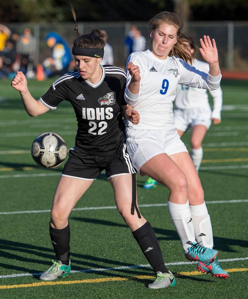 Juneau-Douglas&rsquo; Nikki Box, left, boxes out Thunder Mountain&rsquo;s Sally Thompson at Adair-Kennedy Memorial Park on Tuesday, May 15, 2018. (Michael Penn | Juneau Empire)