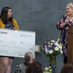 Thunder Mountain High School student Adrianna D&rsquo;Cafango, left, receives a $20,000 award from Juneau Empire Editor Emily Russo Miller during a scholarship awards breakfast at TMHS on Thursday, May 24, 2018. (Michael Penn | Juneau Empire)