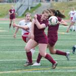 Juneau-Douglas High School&rsquo;s Eva Goering shoots through two Grace Christian defenders in the ASAA Division II state championship game at Service High School on. The ball hit off the crossbar but JDHS won the game 3-0. (Nolin Ainsworth | Juneau Empire)