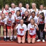 The Juneau-Douglas High School girls soccer team poses after winning the ASAA Division II state championship at Service High School in Anchorage on Saturday. Back Row (L to R): Coach Phil Subeldia, Jasmin Holst, Makenna Graham, Chloe Smith, Nikki Box, Nicole Mannix, Michaela Bentley, Jessie Mayer, Bailey Wery Tagaban, Coach Matt Dusenberry. Middle Row: Taylor Bentley, Katja Steimann, Brianna Jokerst, Shaylin Cesar, Malia Miller, Eva Goering, McKenzie Dimond. Front Row: Marlena Romanoff, Erica Hurtte. (Nolin Ainsworth | Juneau Empire)