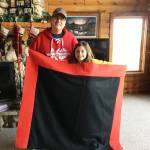 Leah and Michael show off the button blanket. Courtesy image.