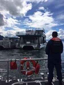 The Allen Marine whale watching boat St. Maria, right, was grounded on a rock Wednesday morning and received help from another Allen Marine boat and the U.S. Coast Guard. (Photo courtesy USCG Station Juneau)