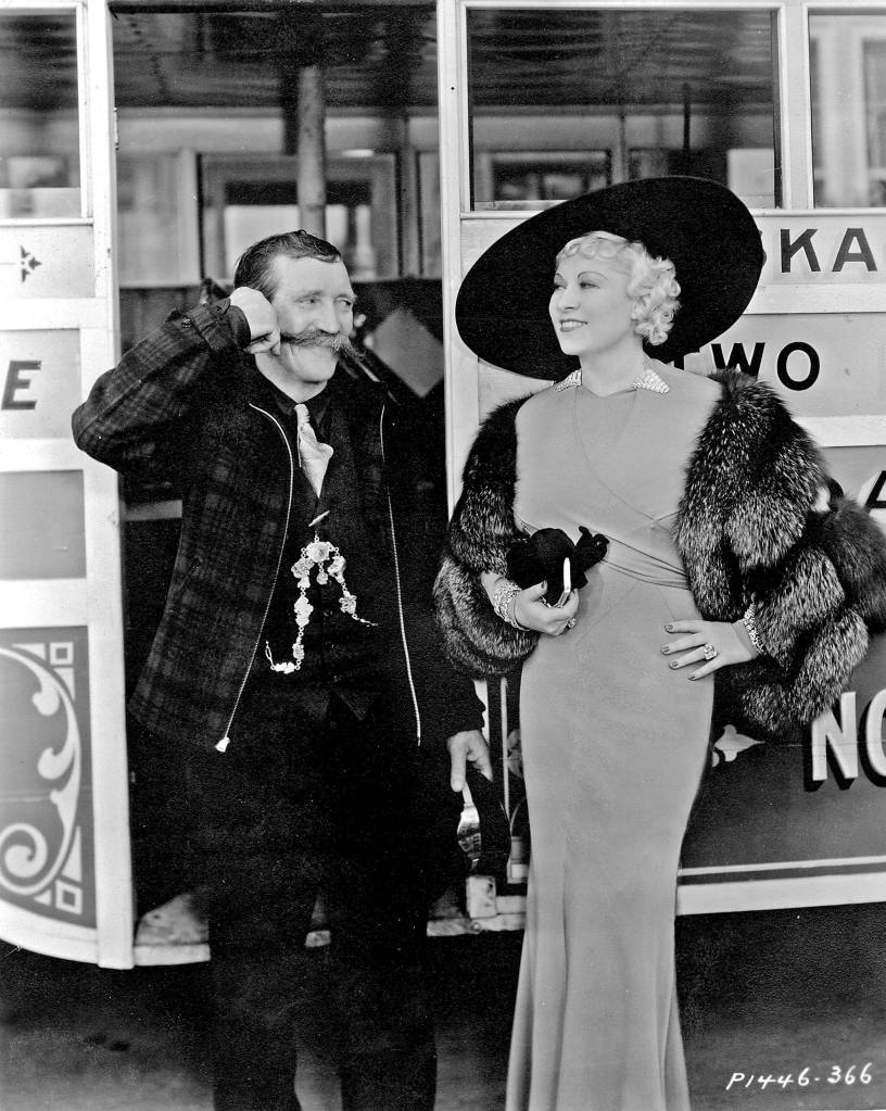 Martin Itjen and Mae West beside Itjen&rsquo;s Skaguay Street Car Number 2 in Hollywood, California, in Feb. 27, 1935. Image courtesy of the Klondike Gold Rush National Historical Park, George & Edna Rapuzzi Collection, KLGO 55772.