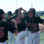 Michael Cesar and the Juneau-Douglas High School baseball team celebrates their state championship win in Anchorage. (Michael Dinneen | For Juneau Empire)