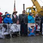 Members of the Yanyeidi clan display pictures of their mothers during the T&rsquo;aaku Kwaan Yanyeidi Healing Kooteeyaa gifting Ceremony, with the raising of the Yanyeidi Wolf totem pole, at Savikko Park on Wednesday, June 6, 2018. (Michael Penn | Juneau Empire)
