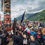 Members of the Yanyeidi clan dance around the Yanyeidi Wolf totem pole after its raising at Savikko Park on Wednesday, June 6, 2018. (Michael Penn | Juneau Empire)