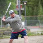 Juneau Post 25 assistant coach Erik McCormick prepares to hit the ball during practice at Adair-Kennedy Memorial Park on Wednesday. (Nolin Ainsworth | Juneau Empire)