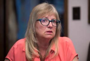 Teresa Robinson, who has two children struggling with addiction, talks about running the Juneau chapter of Parents of Addicted Loved Ones at her Mendenhall Valley home on Tuesday, May 22, 2018. It&rsquo;s a support group for parents who have children dealing with drug or alcohol addictions. (Michael Penn | Juneau Empire)