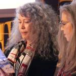 Donna Beaver and Rhonda Mann review a poem together from Nora Dauenhauer&rsquo;s poetry book, &ldquo;The Droning Shaman.&rdquo; Beaver and Mann both read poems by Dauenhauer in her honor. Ray Friedlander | For the Capital City Weekly