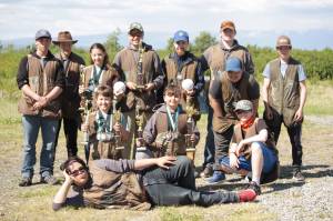 The Juneau trap shooting team. Back row (left to right): Nick Hoek, Harrison Holt, Renee Winn, Brice Norton, Garret Hermann, Luke Ferster, Iosefa Allen, Nolan Ramseth. Front row: Trygve Hermann, Cayden Brenner, Jager Hunt and Maele Allen (on the ground). (Courtesy Photo | Mark Kappler)