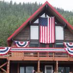 A house at 605 St. Ann&rsquo;s Street places second in the House decorations as Capital City Fire/Rescue Volunteer Firefighters Antonia Elstad and Meg Thordarson tour Douglas properties to judge on Flag Day, Thursday, June 14, 2018. (Michael Penn | Juneau Empire)