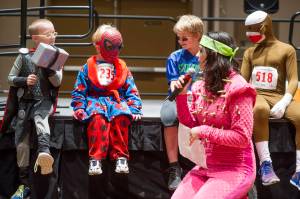 Annie Bartholomew emcees the costume contest before the 2016 Only Fools Run at Midnight Fun Run at Centennial Hall. The race will be housed at the Juneau Arts and Culture Center this year. (Michael Penn | Juneau Empire File)