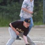 Pirates&rsquo; first baseman Mason Ackman fields a Red Sox infield hit at the Gastineau Channel Little League Junior Division Championship game at Adair-Kennedy Memorial Park on Friday. (Michael Penn | Juneau Empire)