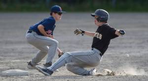 Pirates&rsquo; Josh Carte steals second base as Red Sox&rsquo;s Caden Mesdag fields the throw from home in the third inning at the Gastineau Channel Little League Junior Division Championship game at Adair-Kennedy Memorial Park on Friday. The Pirates won 8-6. (Michael Penn | Juneau Empire)