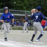 Cubs player Joey Ramseth runs toward first base after bunting the ball to score Ezra Vidal in the first inning of the Gastineau Channel Little League Major Division Championship game on Saturday at Miller Field. Ramseth was safe on the play. (Nolin Ainsworth | Juneau Empire)